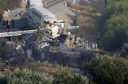 Firefighter work to rescue victims after a Metrolink commuter train en route from Los Angeles' Union Station to Oxnard collided with a freight train in the Chatsworth area